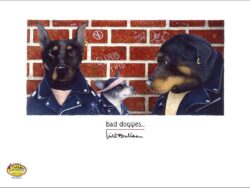 A paper print of three tough looking dogs, standing in front of a brick wall.