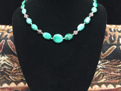 Malachite with Silver Circle of Life beads, is a necklace for sale.